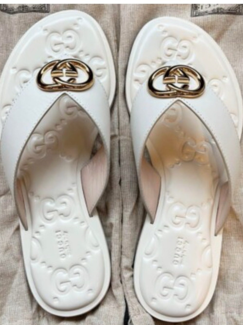 Designer White Leather Thong Sandals with Gold Logo Accent